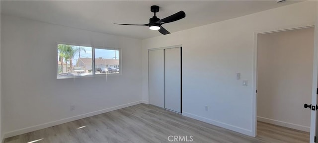 3355 Debbie Ln, Riverside, CA 92501 - unfurnished bedroom featuring light wood-style flooring, a closet, and ceiling fan