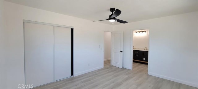 3355 Debbie Ln, Riverside, CA 92501 - unfurnished bedroom with light wood-style flooring, baseboards, a closet, a sink, and ceiling fan