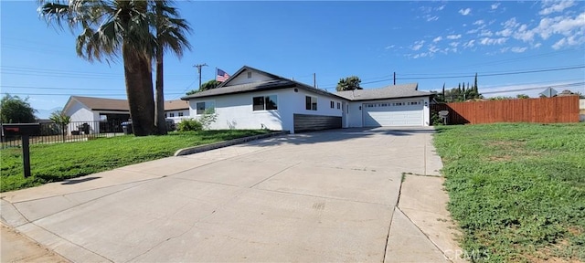 3355 Debbie Ln, Riverside, CA 92501 - single story home featuring a garage, concrete driveway, and stucco siding