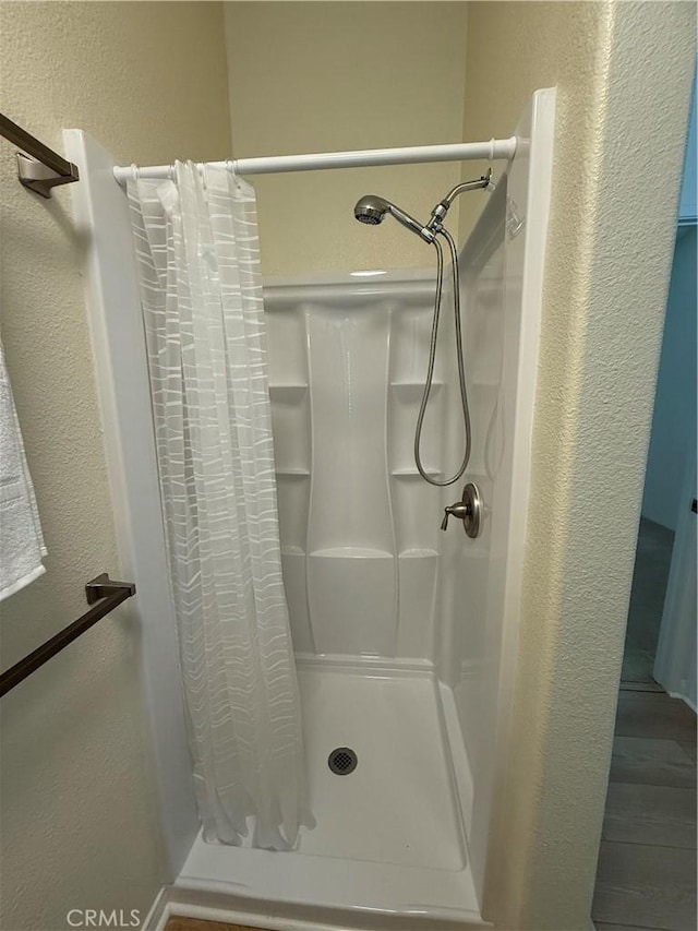 140 W Pioneer Ave Unit 134, Redlands, CA 92374 - full bath with a textured wall and a shower stall