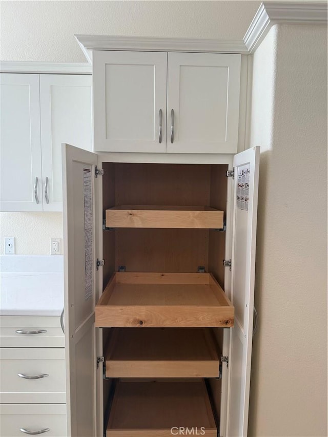 140 W Pioneer Ave Unit 134, Redlands, CA 92374 - kitchen view of white cabinets, light countertops, and open shelves