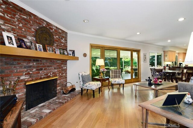 4510 Triste Pl, Tarzana, CA 91356 - living area featuring wood finished floors, a fireplace, ornamental molding, and recessed lighting