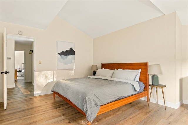 217 Crest Cir, Lake Arrowhead, CA 92352 - bedroom featuring wood finished floors, lofted ceiling, and baseboards
