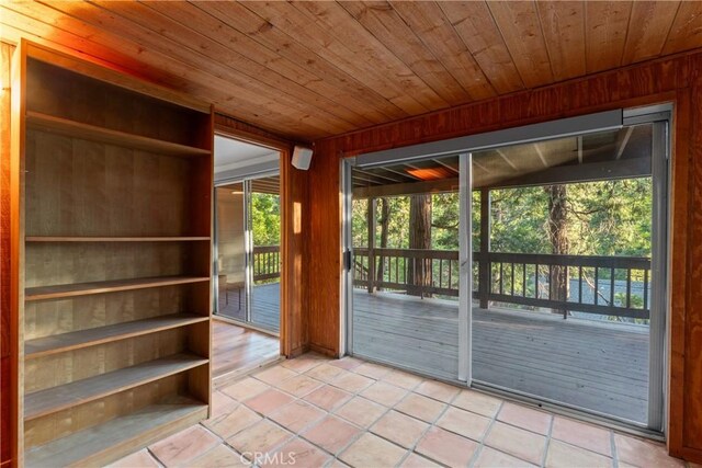 217 Crest Cir, Lake Arrowhead, CA 92352 - entryway featuring wooden ceiling, light tile patterned floors, wood walls, and plenty of natural light