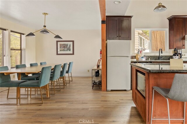 217 Crest Cir, Lake Arrowhead, CA 92352 - kitchen with freestanding refrigerator, healthy amount of natural light, a sink, and light wood finished floors