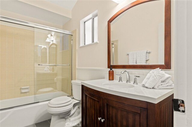 217 Crest Cir, Lake Arrowhead, CA 92352 - bathroom featuring vanity, toilet, and combined bath / shower with glass door