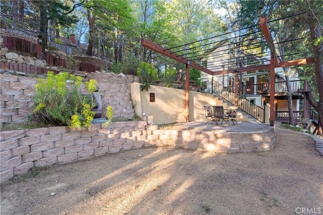 217 Crest Cir, Lake Arrowhead, CA 92352 - view of side of property featuring stairs, a pergola, a wooden deck, and a patio area