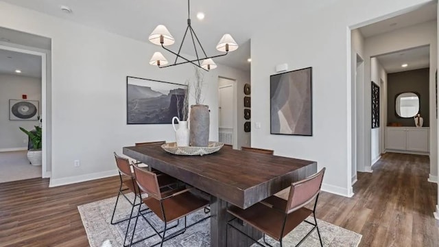 27225 Cranmore Way Unit 302, Valencia, CA 91381 - dining area featuring a chandelier, wood finished floors, and baseboards