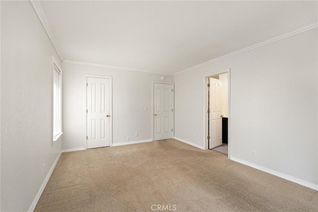 720 E Mountain Ridge Rd, Lake Almanor, CA 96137 - spare room featuring ornamental molding, baseboards, and light colored carpet