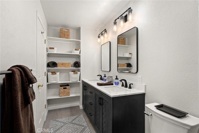 720 E Mountain Ridge Rd, Lake Almanor, CA 96137 - full bathroom featuring double vanity, toilet, wood finished floors, and a textured wall