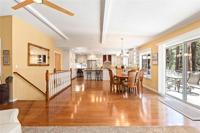 720 E Mountain Ridge Rd, Lake Almanor, CA 96137 - dining space featuring light wood-type flooring, baseboards, a chandelier, and ceiling fan