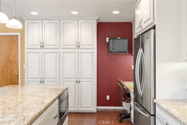 720 E Mountain Ridge Rd, Lake Almanor, CA 96137 - kitchen with stainless steel appliances, dark wood-style floors, white cabinets, a desk, and recessed lighting