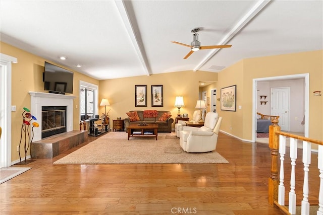 720 E Mountain Ridge Rd, Lake Almanor, CA 96137 - living area with a fireplace, ceiling fan, and wood finished floors