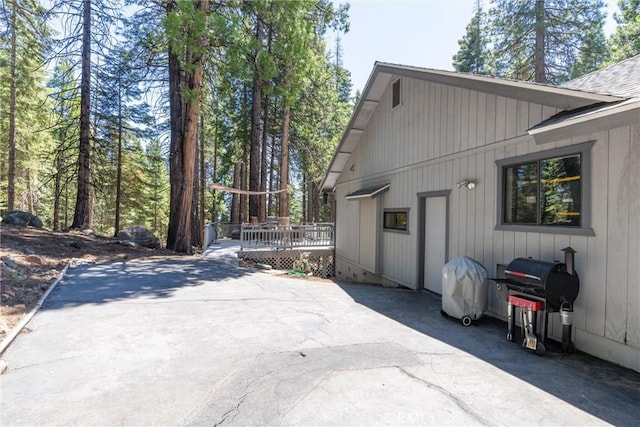720 E Mountain Ridge Rd, Lake Almanor, CA 96137 - view of side of home with a wooden deck