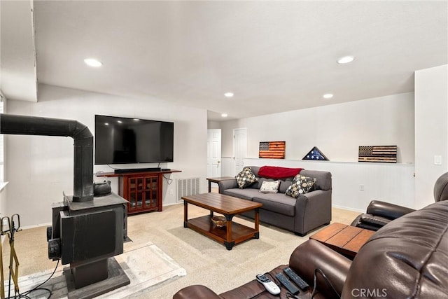 720 E Mountain Ridge Rd, Lake Almanor, CA 96137 - carpeted living room featuring a wood stove, recessed lighting, and baseboards