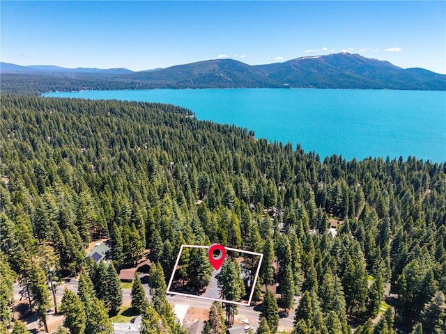 720 E Mountain Ridge Rd, Lake Almanor, CA 96137 - aerial overview of property's location featuring a forest, a water and mountain view, and property boundaries highlighted