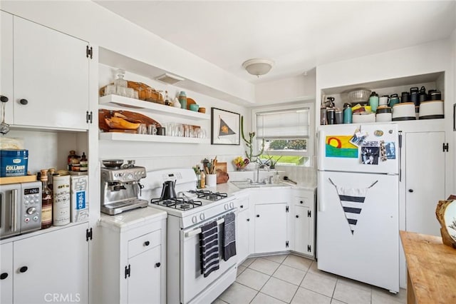 295 Wave St, Laguna Beach, CA 92651 - kitchen with white appliances, open shelves, and light countertops