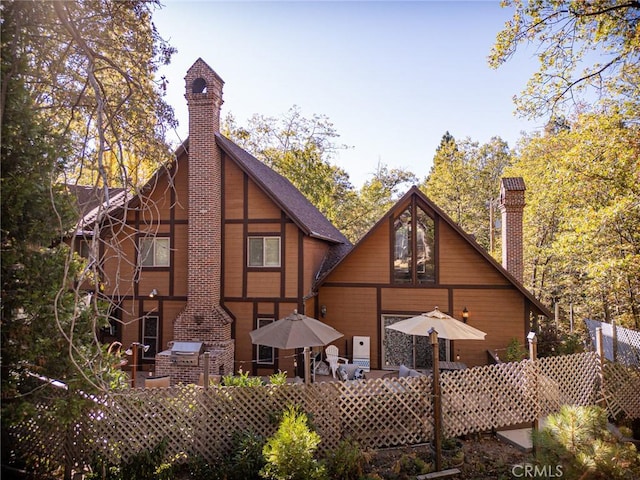 951 Osprey Ln, Lake Arrowhead, CA 92352 - back of house featuring a chimney