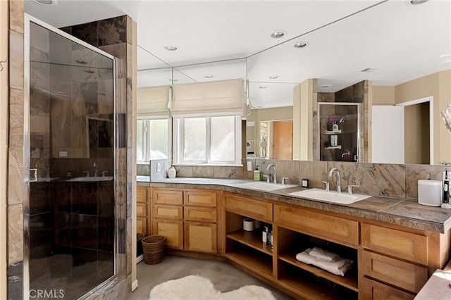 951 Osprey Ln, Lake Arrowhead, CA 92352 - bathroom featuring a stall shower, double vanity, backsplash, and recessed lighting