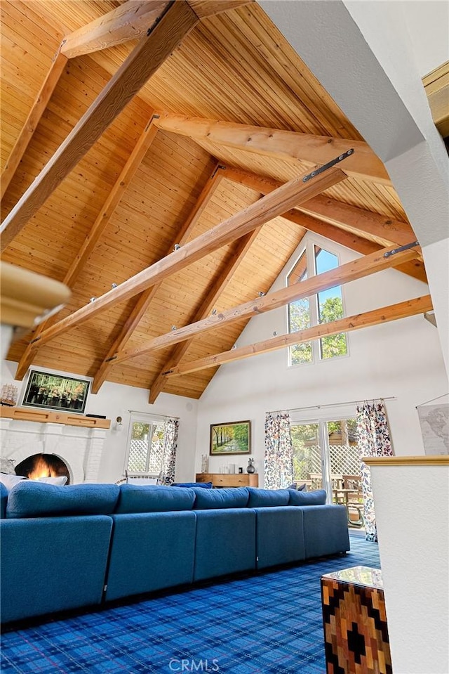 951 Osprey Ln, Lake Arrowhead, CA 92352 - living room featuring wood ceiling with exposed beams, high vaulted ceiling, and a warm lit fireplace