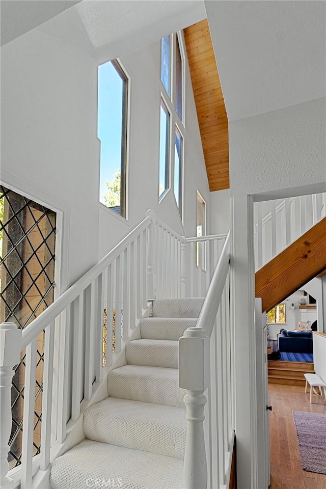 951 Osprey Ln, Lake Arrowhead, CA 92352 - staircase featuring high vaulted ceiling and wood finished floors