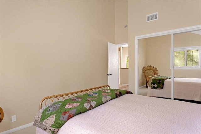 951 Osprey Ln, Lake Arrowhead, CA 92352 - bedroom featuring a closet, carpet flooring, baseboards, and a towering ceiling