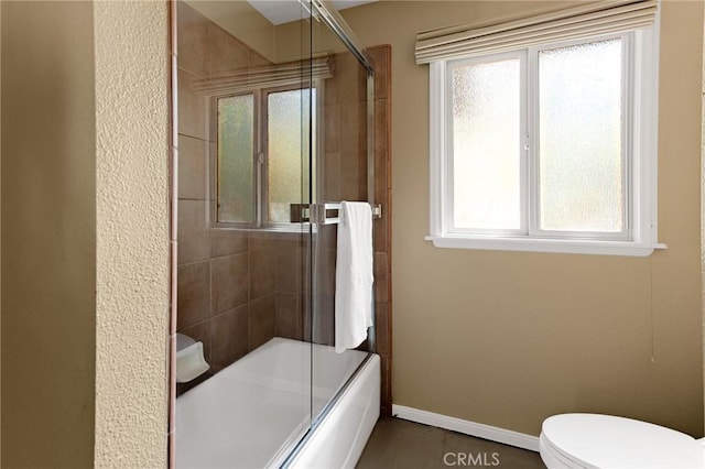 951 Osprey Ln, Lake Arrowhead, CA 92352 - full bathroom featuring plenty of natural light, toilet, combined bath / shower with glass door, and baseboards