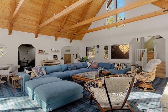 951 Osprey Ln, Lake Arrowhead, CA 92352 - carpeted living room featuring wooden ceiling with exposed beams, high vaulted ceiling, stairs, and arched walkways