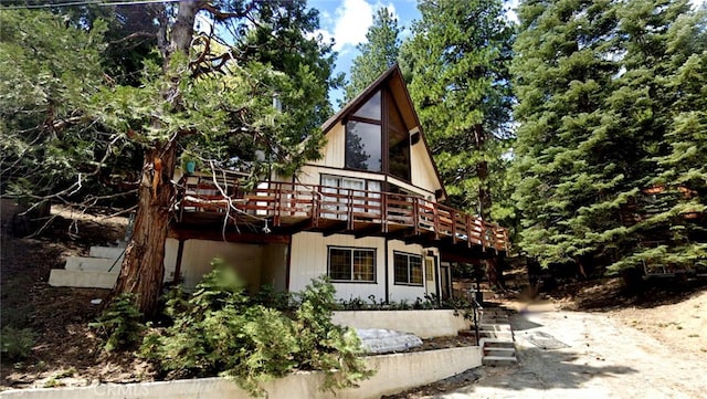 1928 Wilderness Rd, Running Springs, CA 92382 - view of front facade with a deck