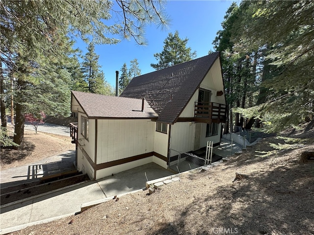1928 Wilderness Rd, Running Springs, CA 92382 - view of side of property with a shingled roof and a balcony