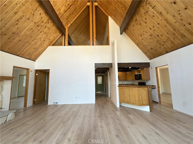 1928 Wilderness Rd, Running Springs, CA 92382 - unfurnished living room with high vaulted ceiling, light wood-type flooring, and wooden ceiling with exposed beams