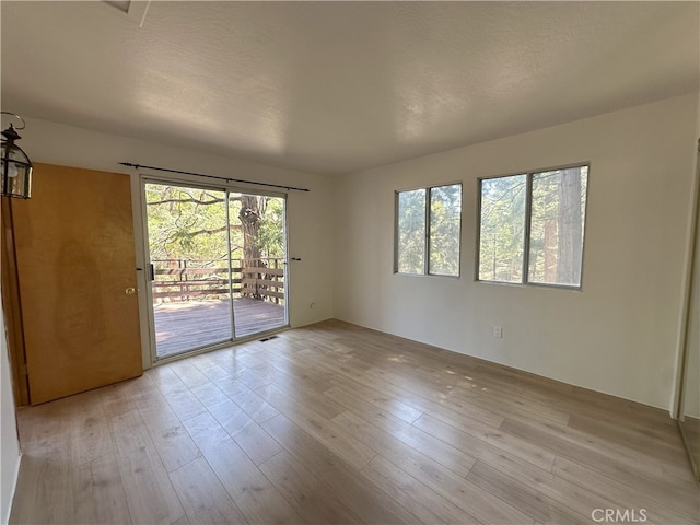 1928 Wilderness Rd, Running Springs, CA 92382 - spare room featuring hardwood / wood-style floors