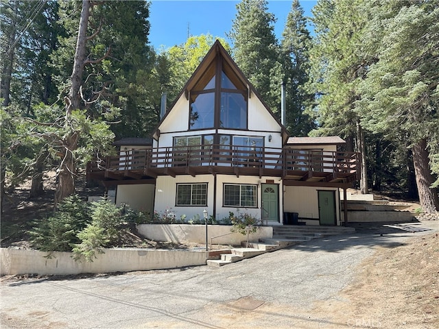 1928 Wilderness Rd, Running Springs, CA 92382 - view of front of property featuring a balcony and a deck