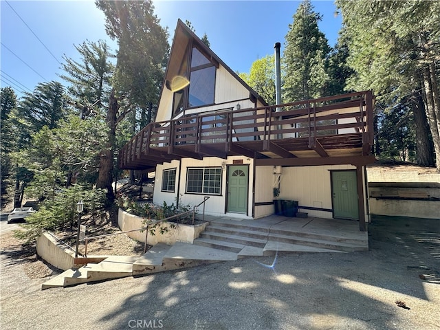 1928 Wilderness Rd, Running Springs, CA 92382 - back of house featuring a wooden deck