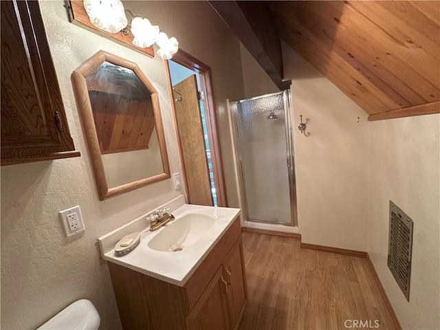 1928 Wilderness Rd, Running Springs, CA 92382 - bathroom featuring wood finished floors, vanity, a shower stall, toilet, and a textured wall