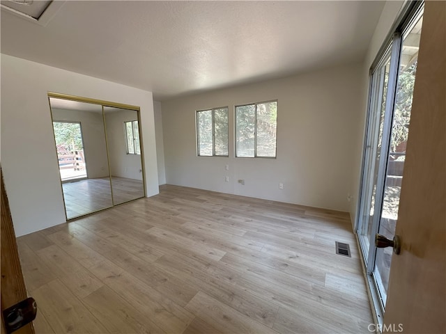 1928 Wilderness Rd, Running Springs, CA 92382 - unfurnished bedroom with light wood-style floors and a closet