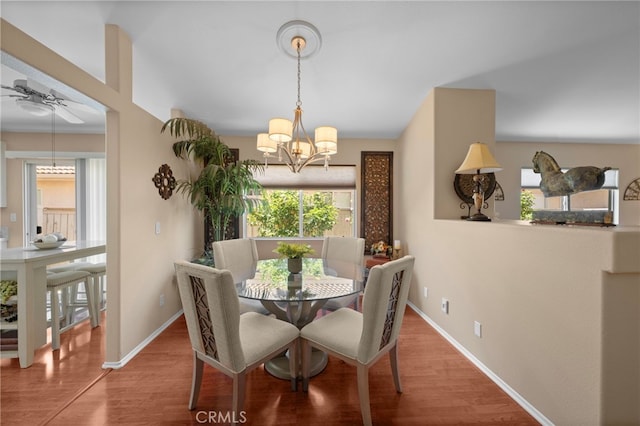 23981 Via Astuto, Murrieta, CA 92562 - dining room featuring wood finished floors, baseboards, and a chandelier