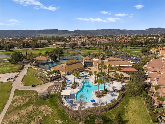 23981 Via Astuto, Murrieta, CA 92562 - view of property location featuring a pool, mountains, and nearby suburban area
