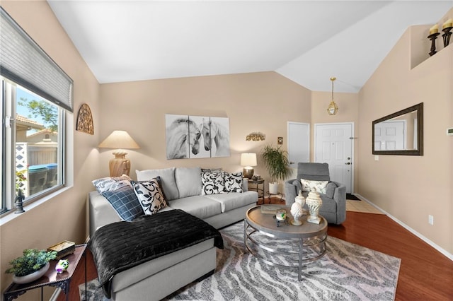 23981 Via Astuto, Murrieta, CA 92562 - living area with wood finished floors, vaulted ceiling, and baseboards