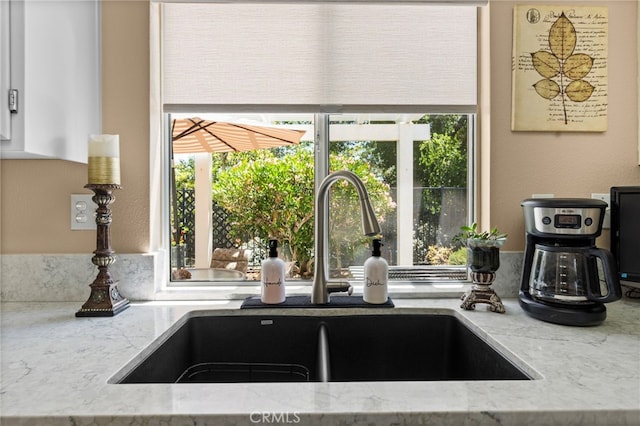 23981 Via Astuto, Murrieta, CA 92562 - kitchen view of a sink and light stone counters