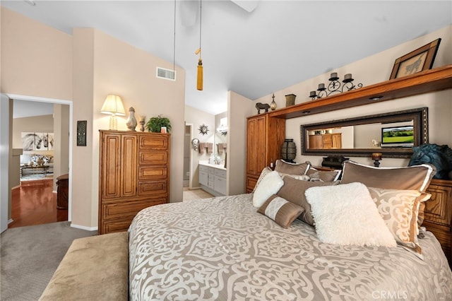 23981 Via Astuto, Murrieta, CA 92562 - carpeted bedroom with high vaulted ceiling and ensuite bath