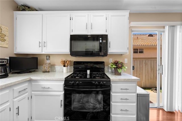 23981 Via Astuto, Murrieta, CA 92562 - kitchen featuring black appliances and white cabinetry
