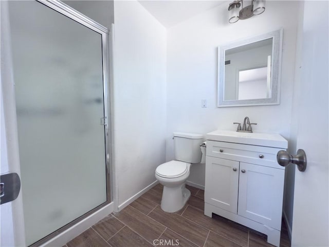 15156 Kinai Rd, Apple Valley, CA 92307 - full bathroom with vanity, a shower stall, toilet, and wood finish floors