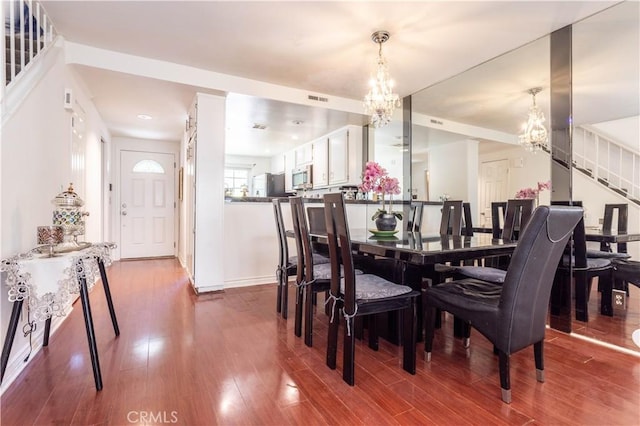 5538 Las Virgenes Rd Unit 142, Calabasas, CA 91302 - dining space with a chandelier, stairs, dark wood finished floors, and baseboards