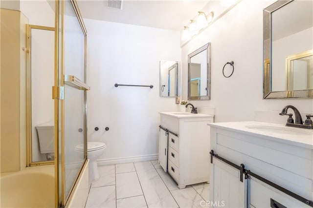 5538 Las Virgenes Rd Unit 142, Calabasas, CA 91302 - full bath with marble look tiles, two vanities, toilet, and combined bath / shower with glass door