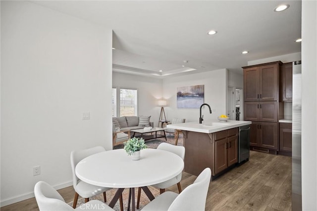 5560 Keith Rd, Paradise, CA 95969 - dining area with light wood finished floors, recessed lighting, baseboards, and a raised ceiling