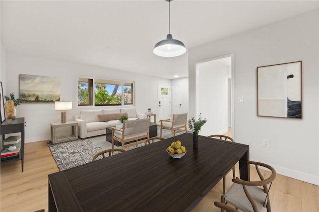25801 Roanoke Rd, Menifee, CA 92586 - dining space featuring light wood-style floors and baseboards