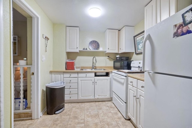 1080 Buena Pl, Carlsbad, CA 92008 - kitchen with white appliances, a sink, white cabinets, and light countertops