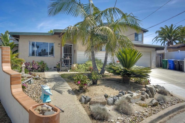 1080 Buena Pl, Carlsbad, CA 92008 - view of front of home with concrete driveway, stucco siding, and a garage