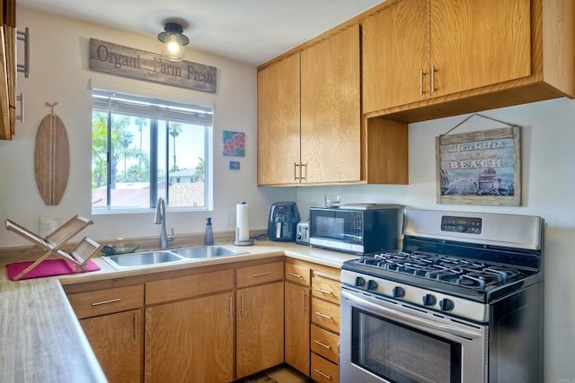 1080 Buena Pl, Carlsbad, CA 92008 - kitchen with appliances with stainless steel finishes, a sink, and light countertops